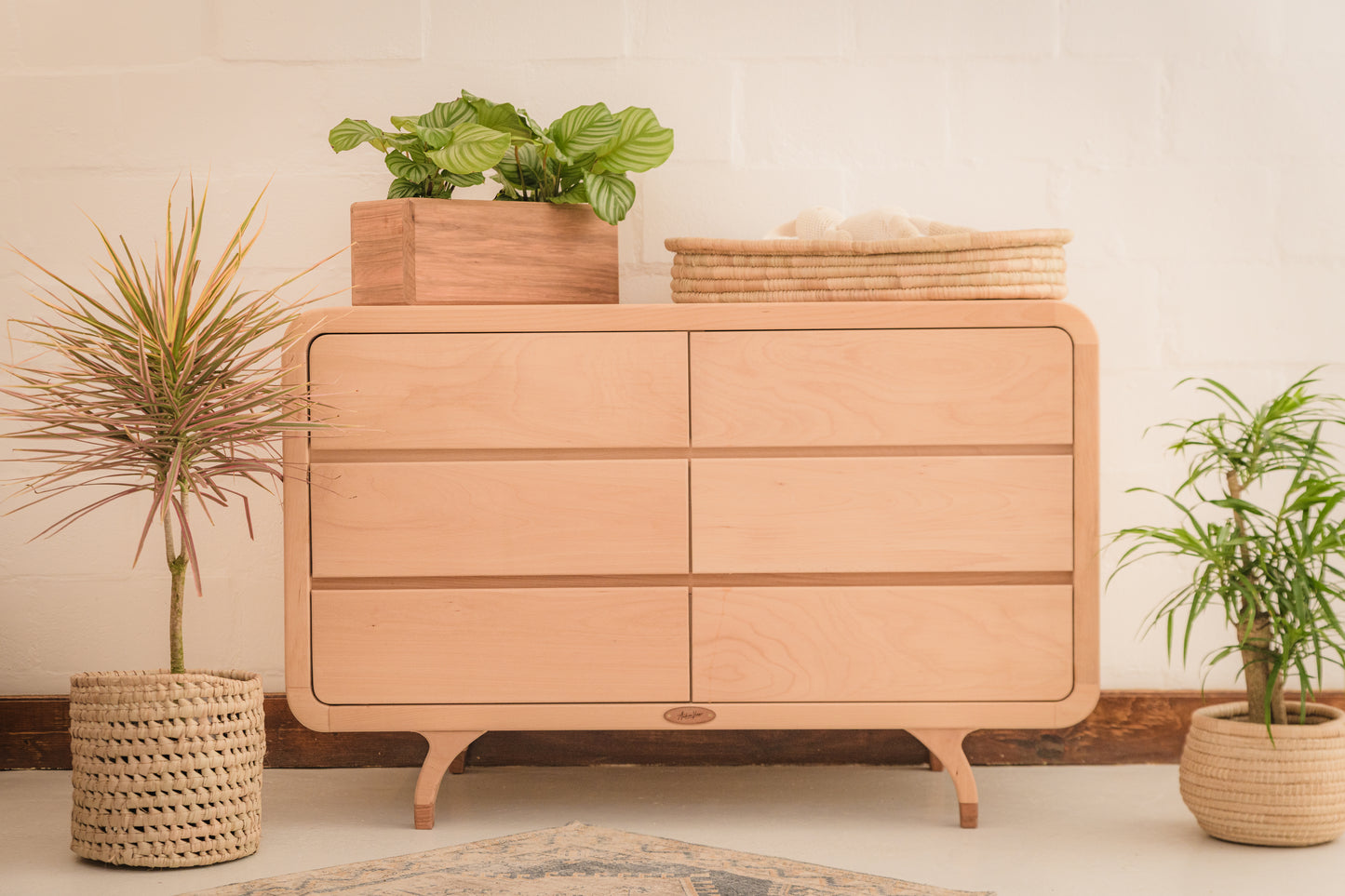 Handcrafted Love Local Niki hardwood compactum made from natural Beechwood, featuring six soft-close drawers and curved edges for a warm, elegant nursery aesthetic.