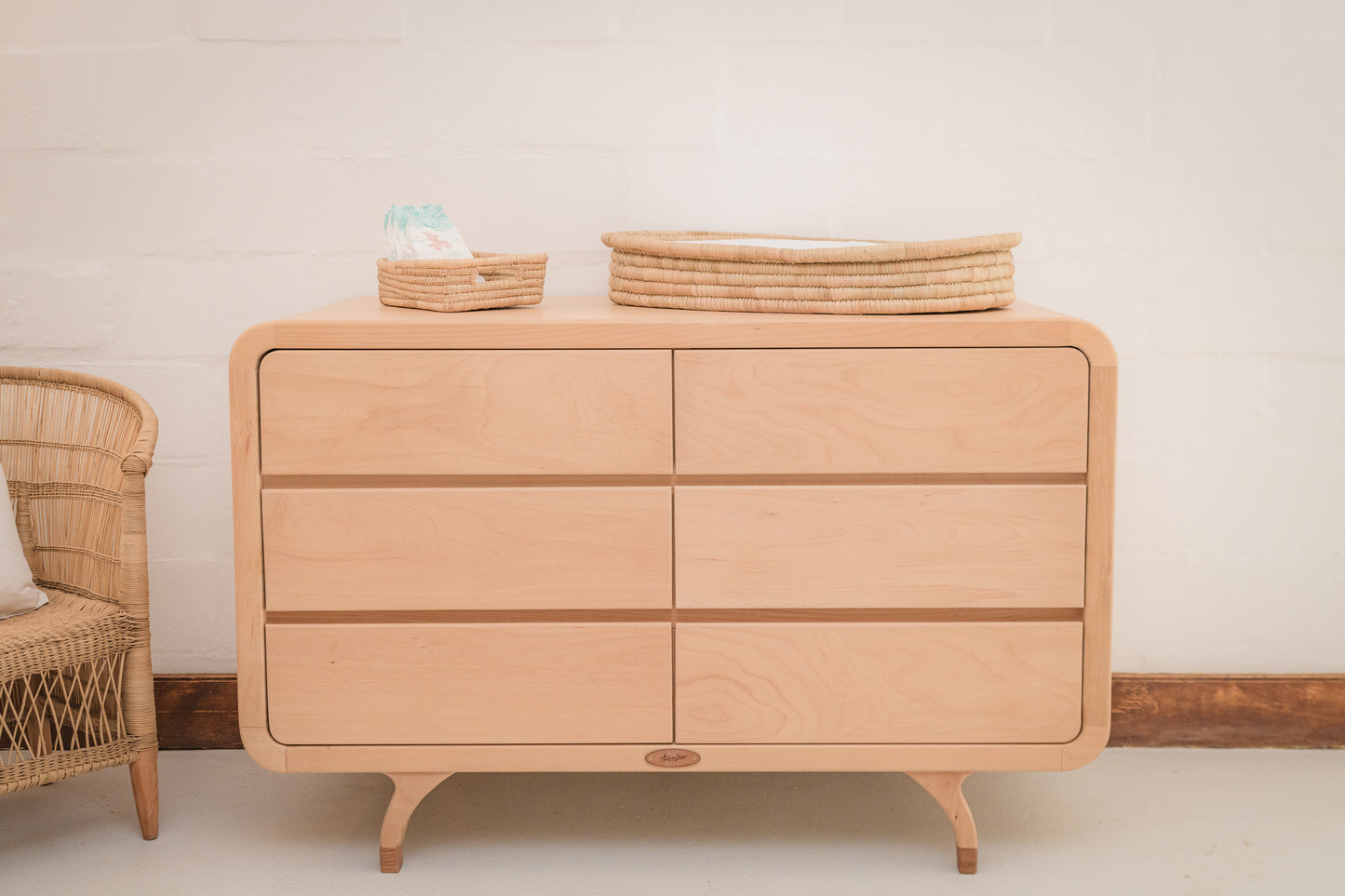 Handcrafted Love Local Niki hardwood compactum made from natural Beechwood, featuring six soft-close drawers and curved edges for a warm, elegant nursery aesthetic.