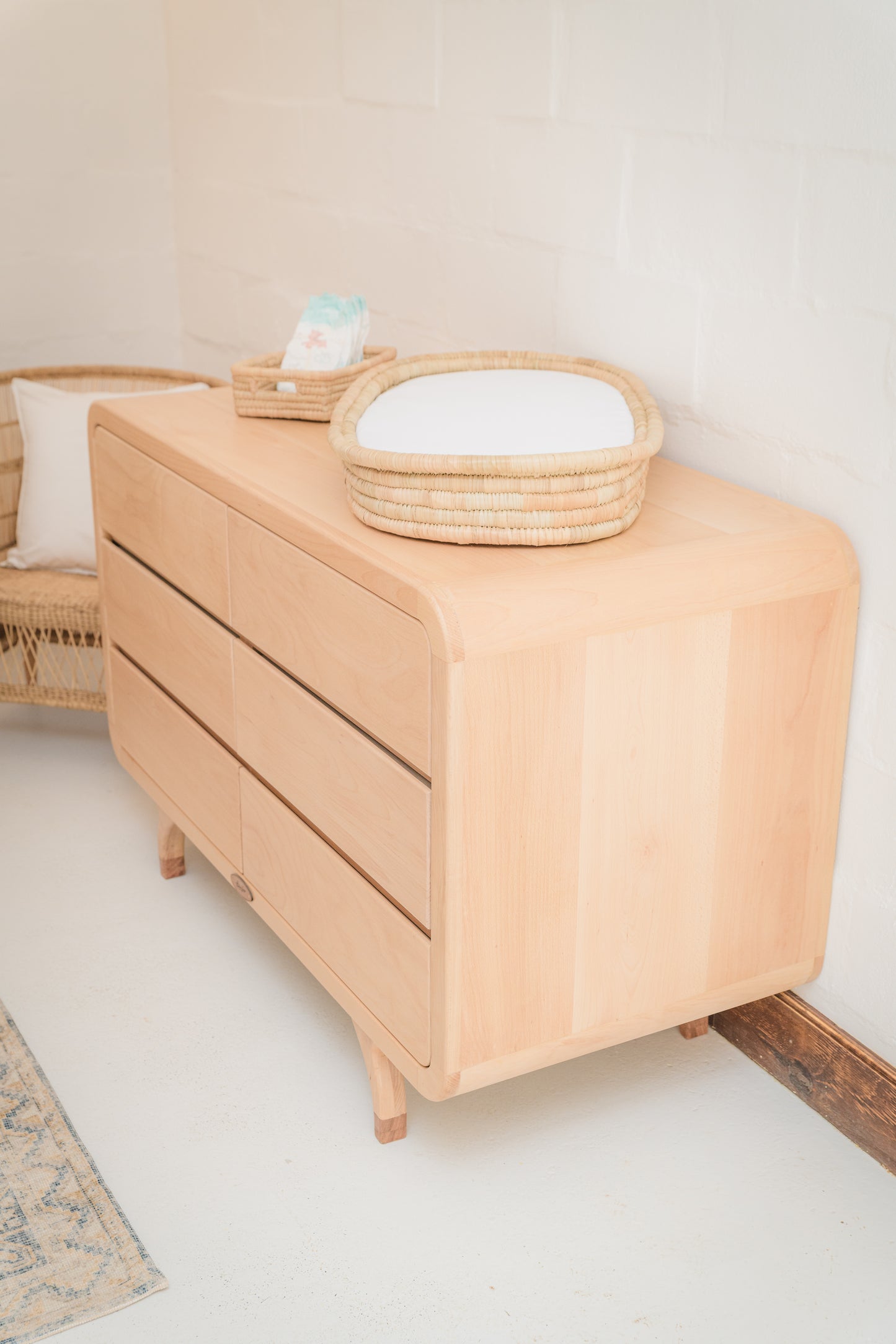 Handcrafted Love Local Niki hardwood compactum made from natural Beechwood, featuring six soft-close drawers and curved edges for a warm, elegant nursery aesthetic.