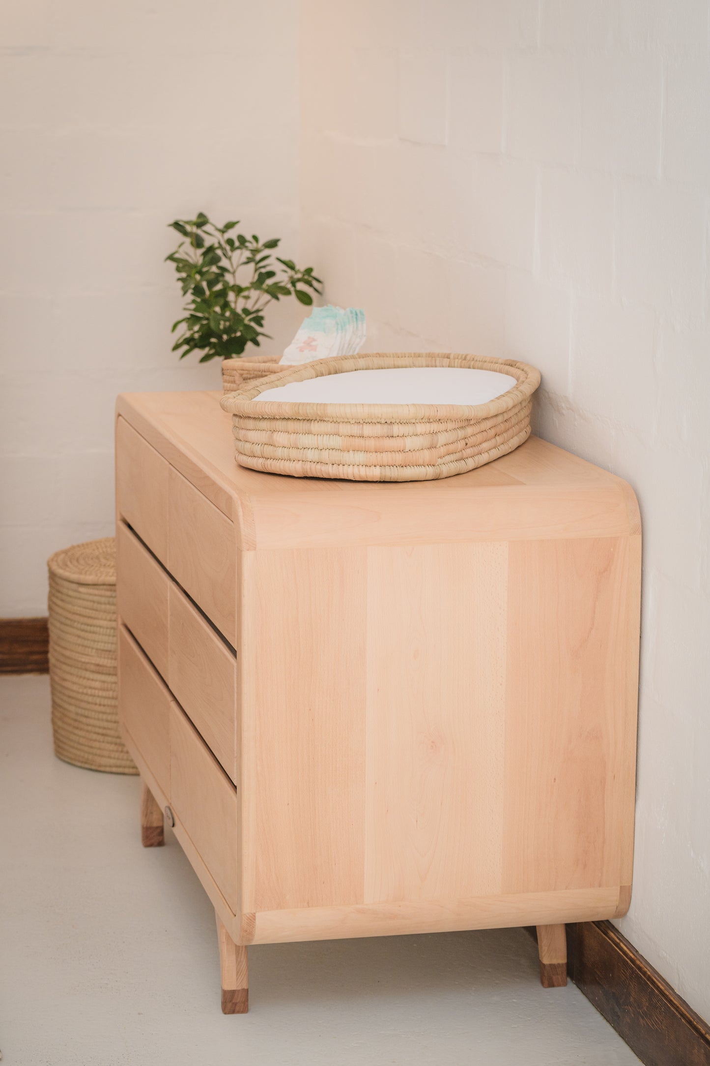 Handcrafted Love Local Niki hardwood compactum made from natural Beechwood, featuring six soft-close drawers and curved edges for a warm, elegant nursery aesthetic.