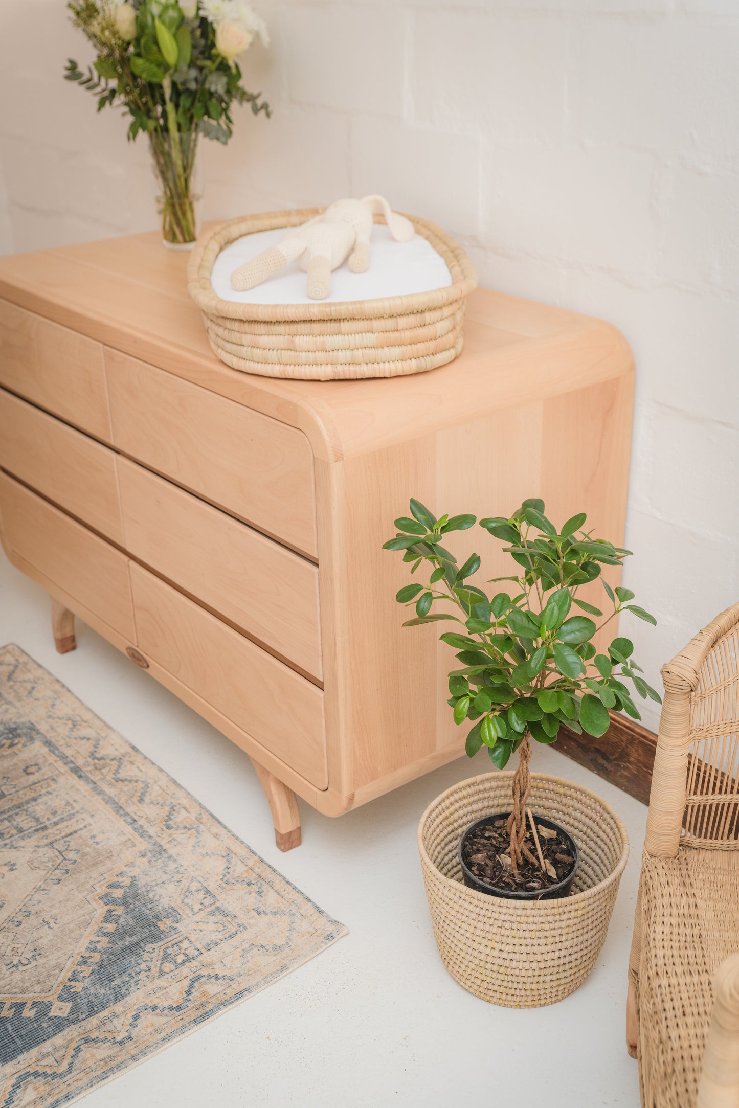 Handcrafted Love Local Niki hardwood compactum made from natural Beechwood, featuring six soft-close drawers and curved edges for a warm, elegant nursery aesthetic.