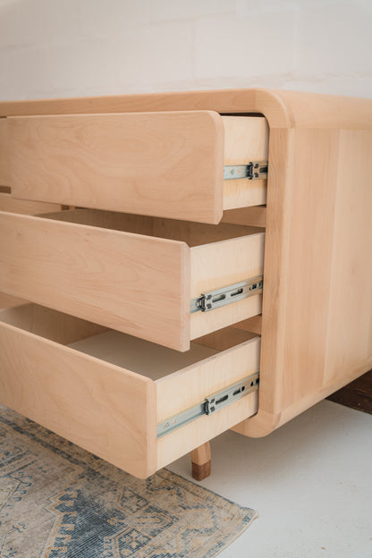 Handcrafted Love Local Niki hardwood compactum made from natural Beechwood, featuring six soft-close drawers and curved edges for a warm, elegant nursery aesthetic.