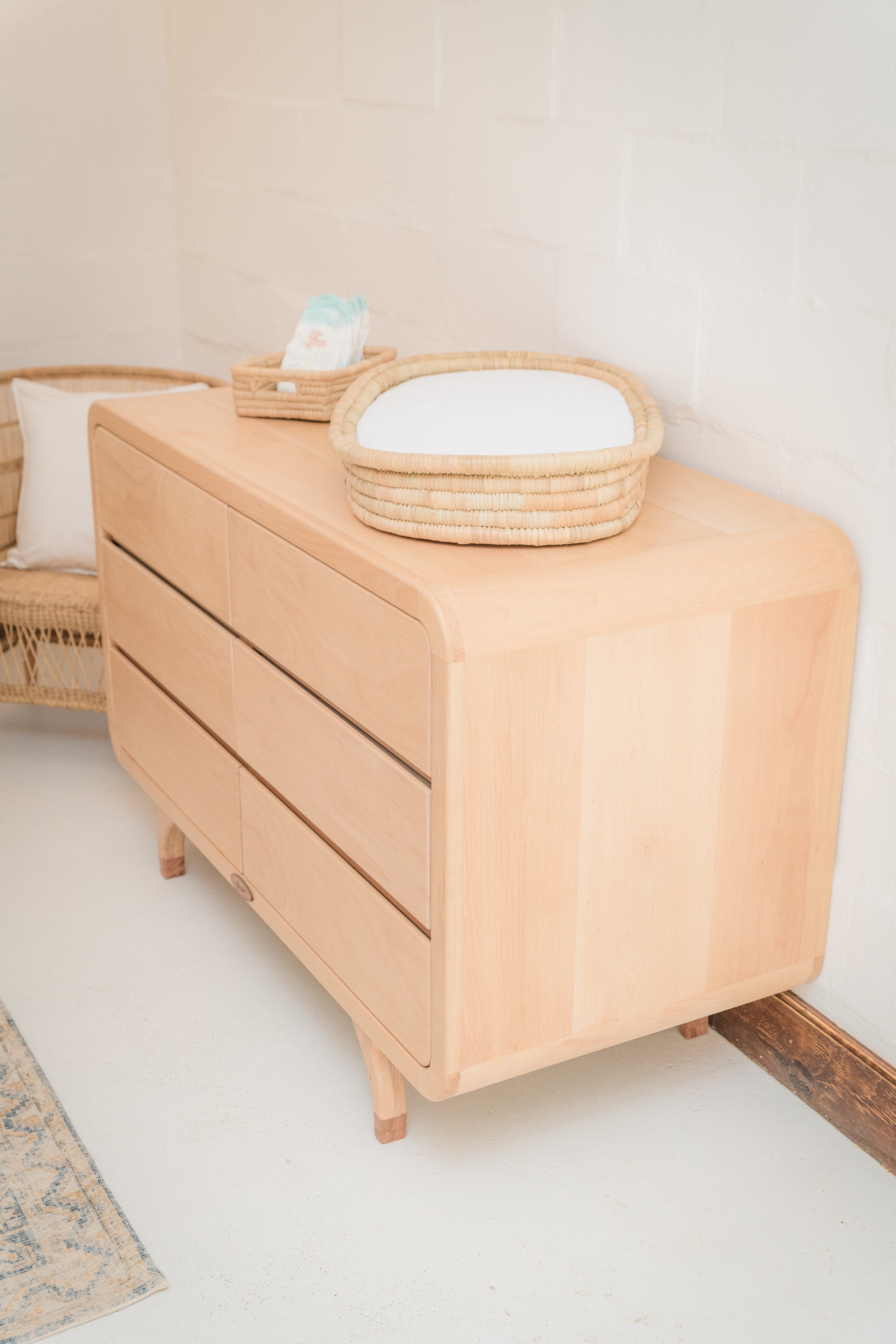 Handcrafted Love Local Niki hardwood compactum made from natural Beechwood, featuring six soft-close drawers and curved edges for a warm, elegant nursery aesthetic.