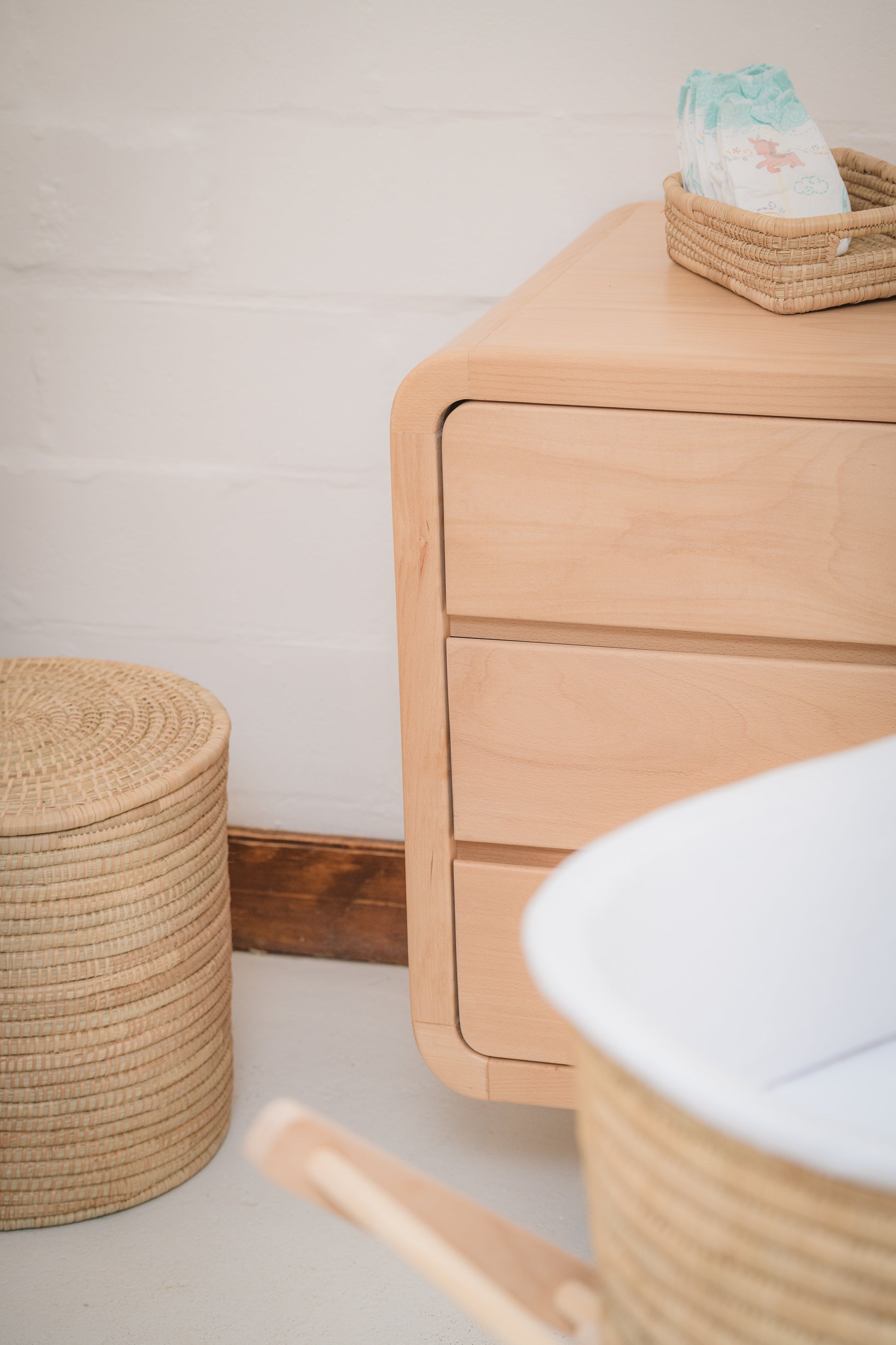 Handcrafted Love Local Niki hardwood compactum made from natural Beechwood, featuring six soft-close drawers and curved edges for a warm, elegant nursery aesthetic.