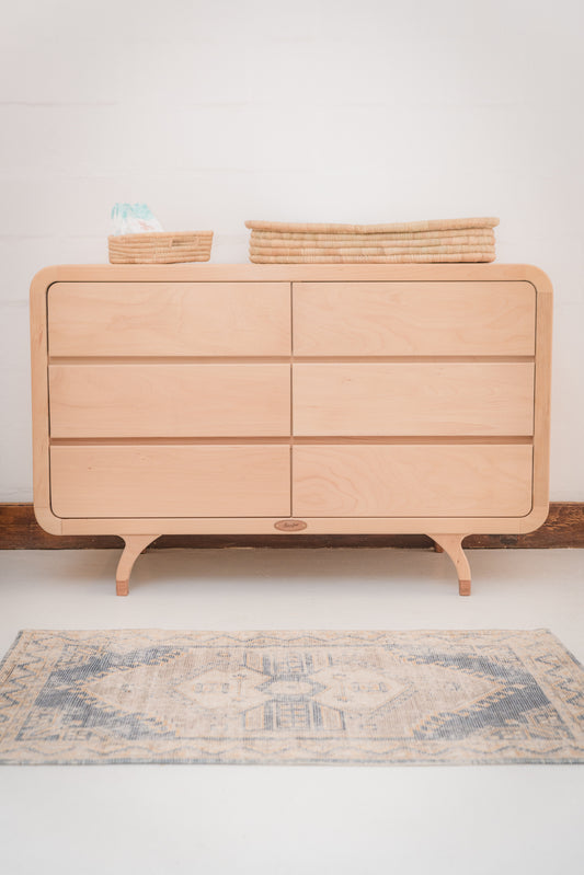 Handcrafted Love Local Niki hardwood compactum made from natural Beechwood, featuring six soft-close drawers and curved edges for a warm, elegant nursery aesthetic.